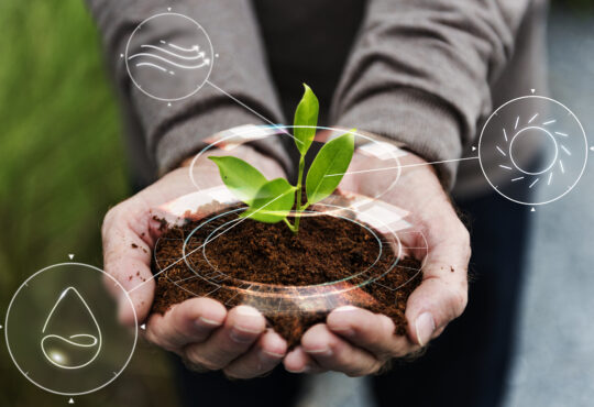 Smart agriculture iot with hand planting tree background