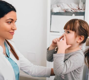Little patient describing her breathing problem to pediatrician