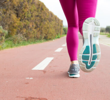 Close up of sportswoman training alone on stadium